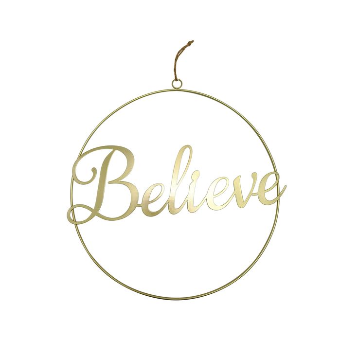 the word believe in gold foil on a round metal ornament hanging from a string