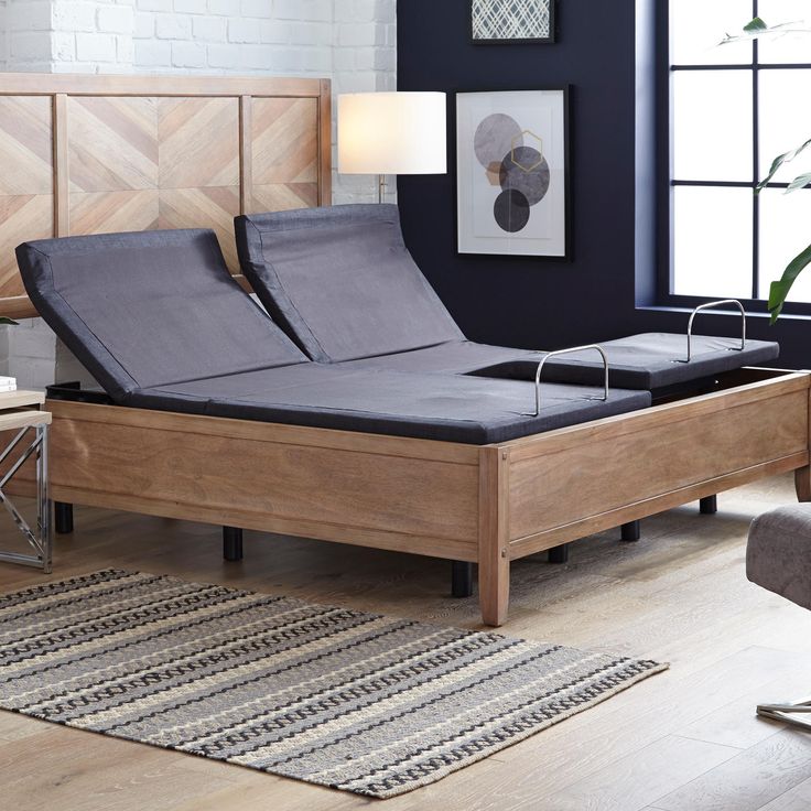 a bed that is sitting on top of a hard wood floor