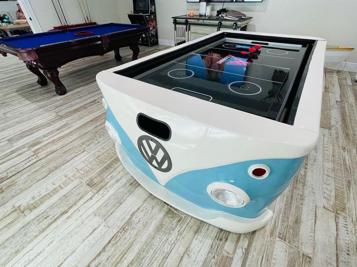 a pool table in the shape of a vw bus