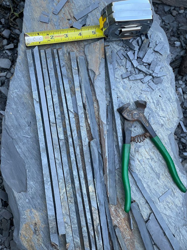 tools are laying on top of some rocks