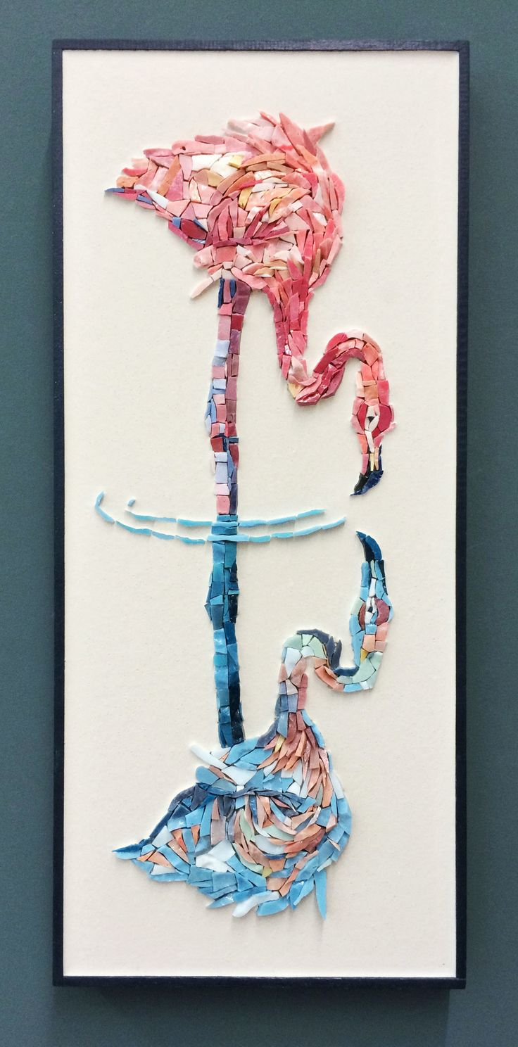 a piece of art made out of paper with flamingos on the top and bottom