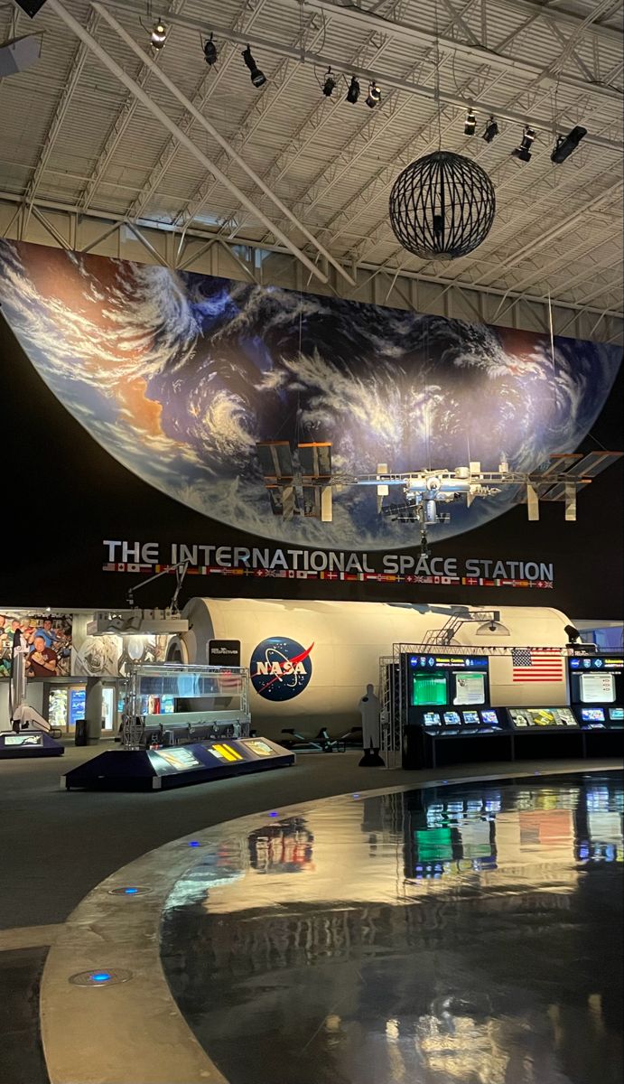 the inside of an airport with many different displays on it's walls and ceiling