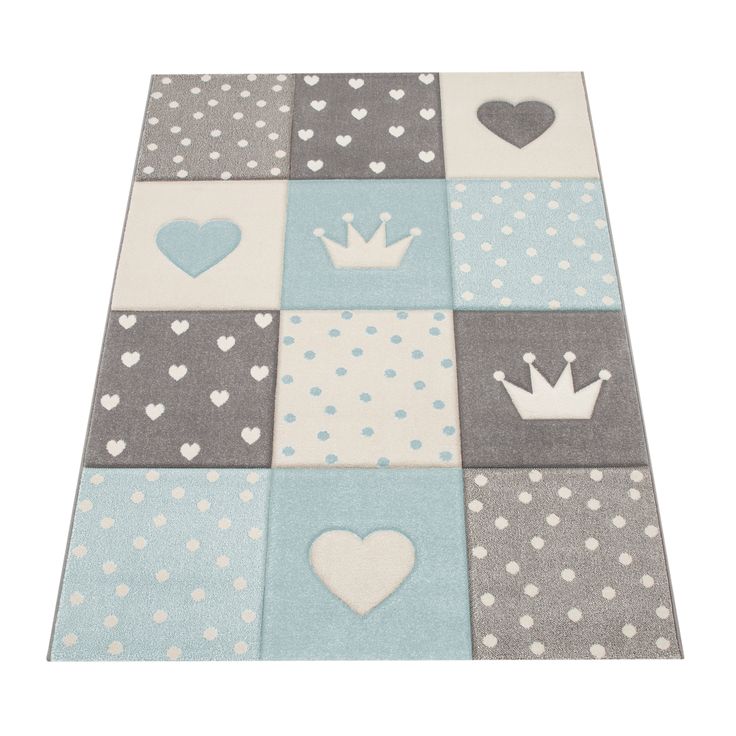 a blue and gray rug with hearts, crowns and dots on the floor in different colors