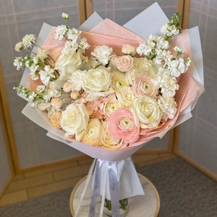 a bouquet of flowers sitting on top of a table