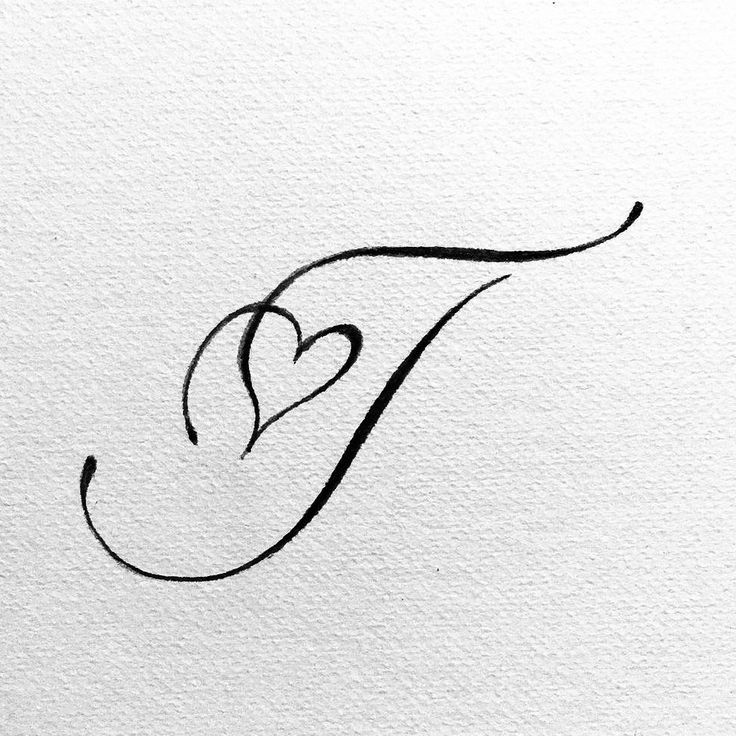 the letter f is made up of black ink and has a heart drawn on it