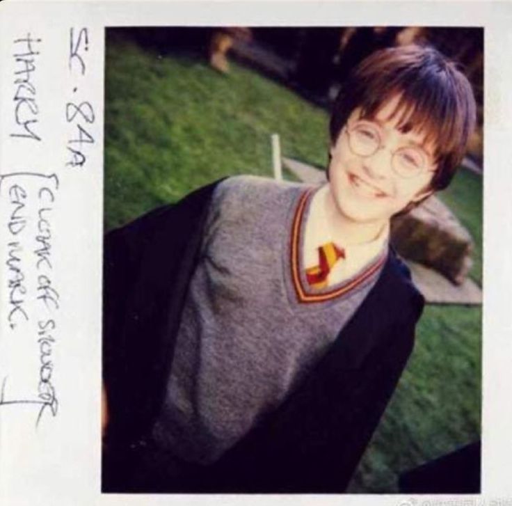 an old photo of harry potter from the wizard's ball in front of some grass