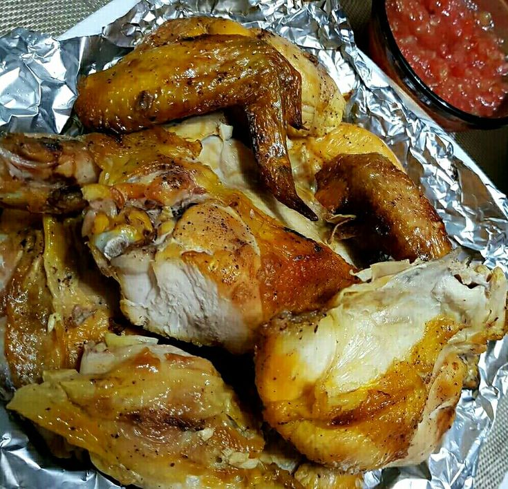 chicken wings covered in tin foil with sauce