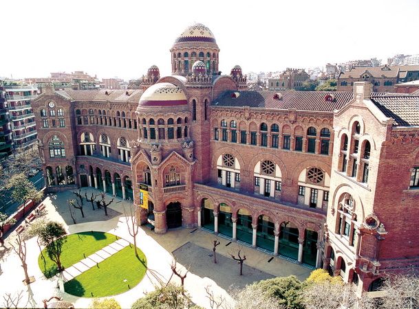 an aerial view of a large building with many windows