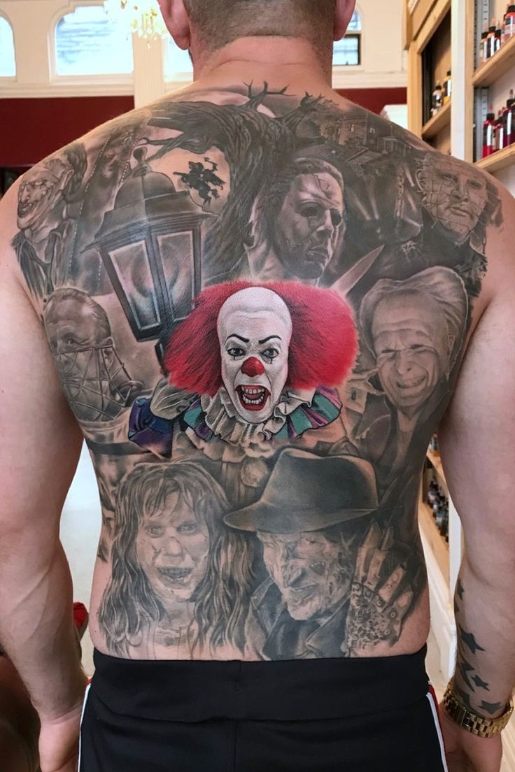 the back of a man's body with tattoos on it, including clowns