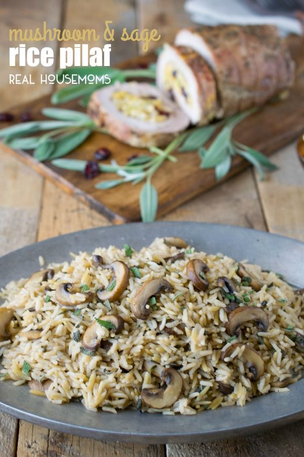 a plate full of rice and mushrooms on a wooden table next to other food items