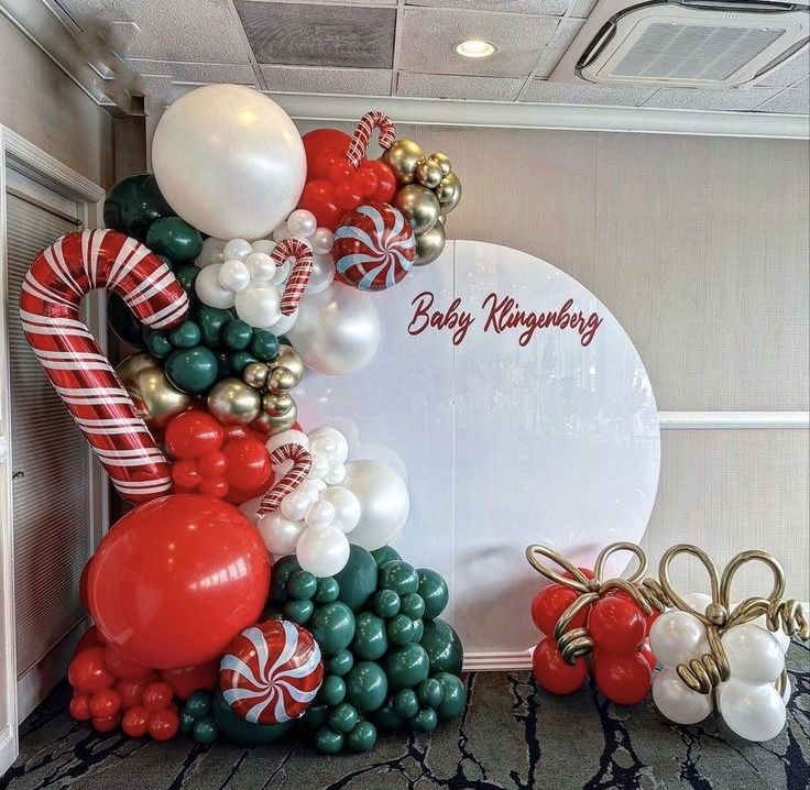 balloon arch with candy canes and christmas decorations