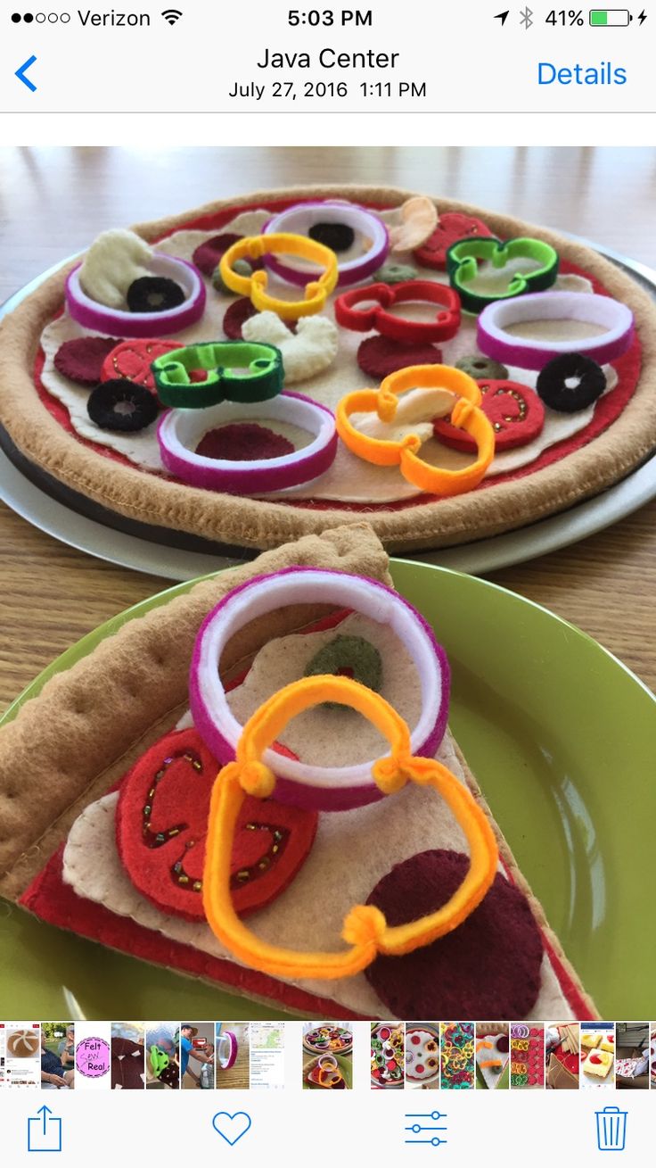 two slices of pizza sitting on top of a green plate