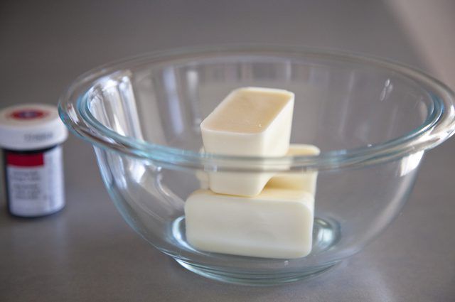 two cubes of butter sit in a glass bowl