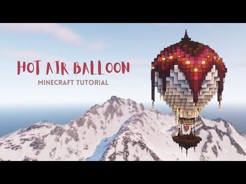 a hot air balloon flying over a snow covered mountain top with the words hot air balloon