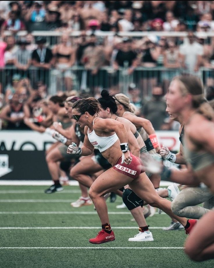 a group of women running across a field