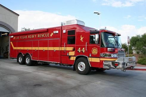 a red fire truck parked in front of a building