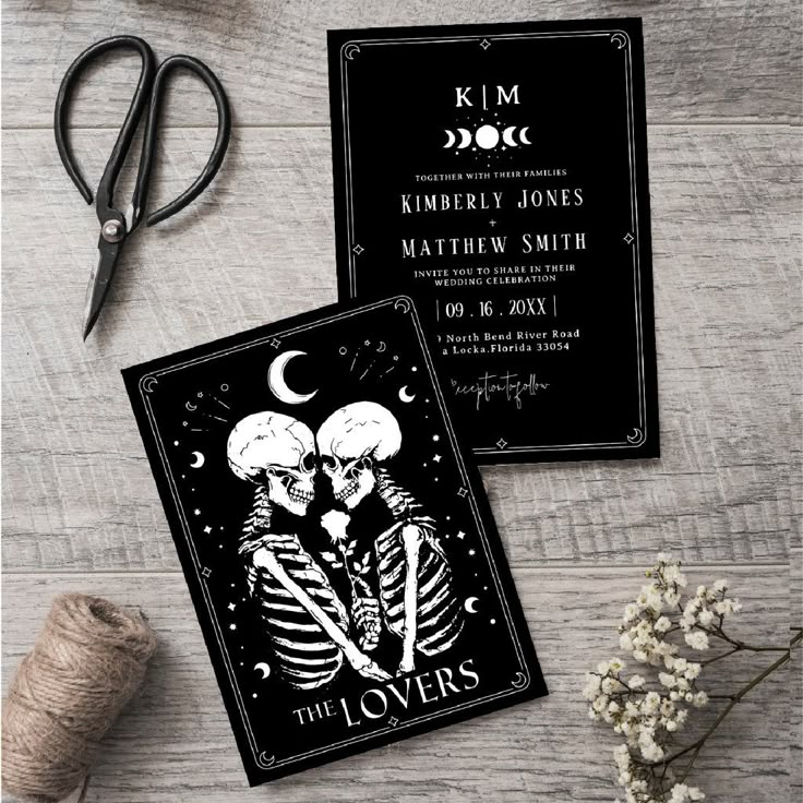 two skeletons in love on black wedding stationery with scissors and twine spools