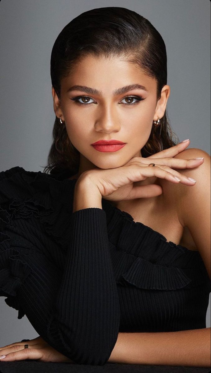 an image of a woman posing for a magazine cover with her hand on her chin