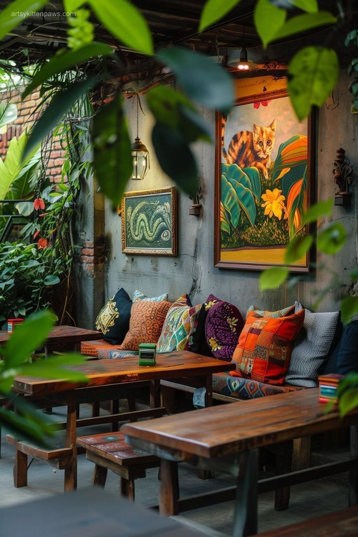 an outdoor seating area with wooden tables and benches