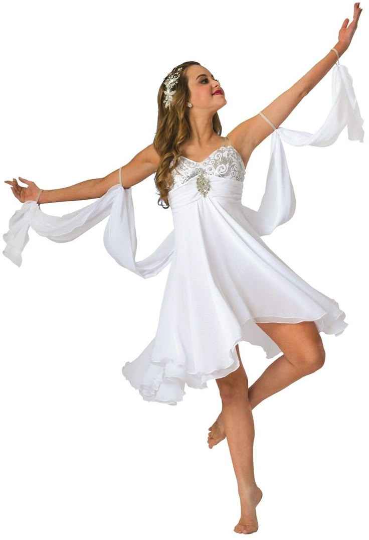 a woman in a white dress is dancing