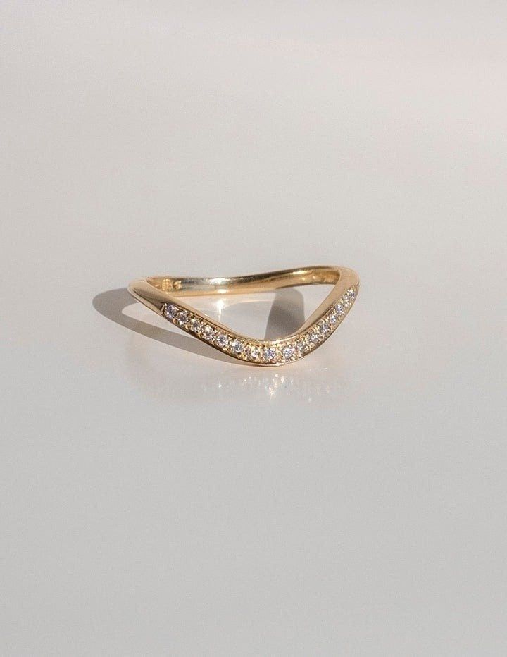 a yellow gold ring with two rows of diamonds