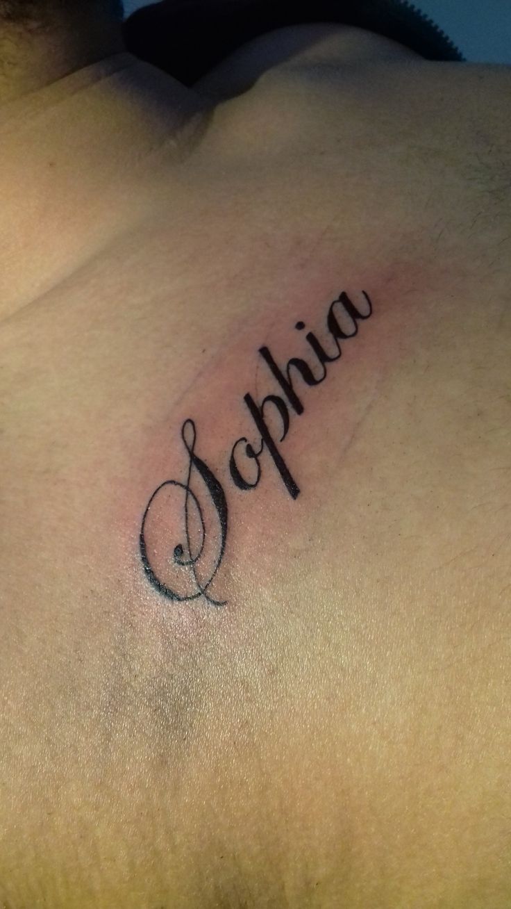 a man with a tattoo on his chest has the wordopia written in cursive font