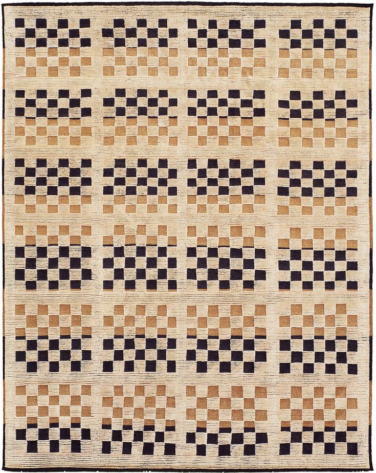 an old rug with black and brown squares on it