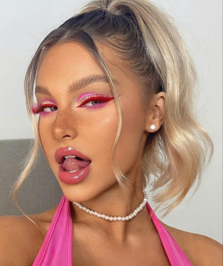 a woman with bright pink makeup and pearls on her neck is posing for the camera