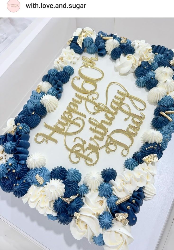 a birthday cake with blue and white flowers on it that says, happy 50th in gold lettering