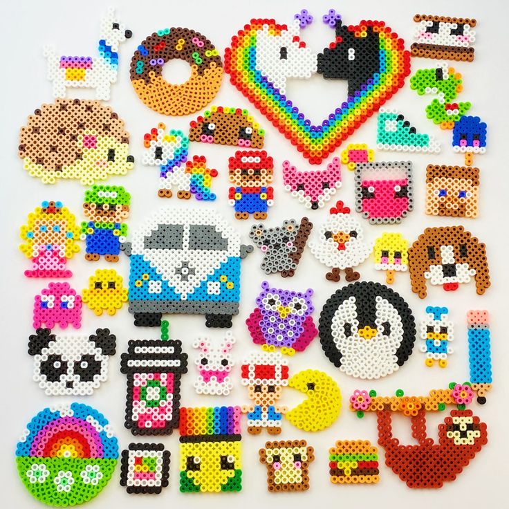 a bunch of pixelated objects are arranged on a white surface