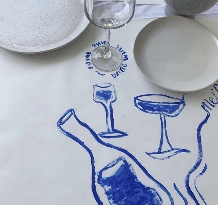 there is a drawing on the table with wine glasses and plates next to each other