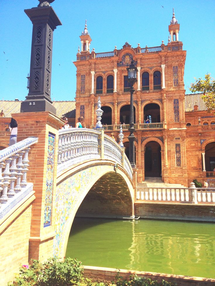 a bridge over a body of water in front of a building