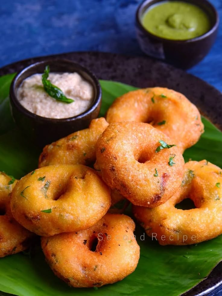 some fried food on a plate with dipping sauce