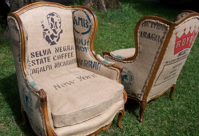 two old chairs are sitting in the grass