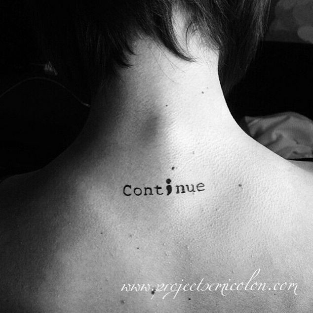 the back of a woman's neck with an inscription that reads continue on it