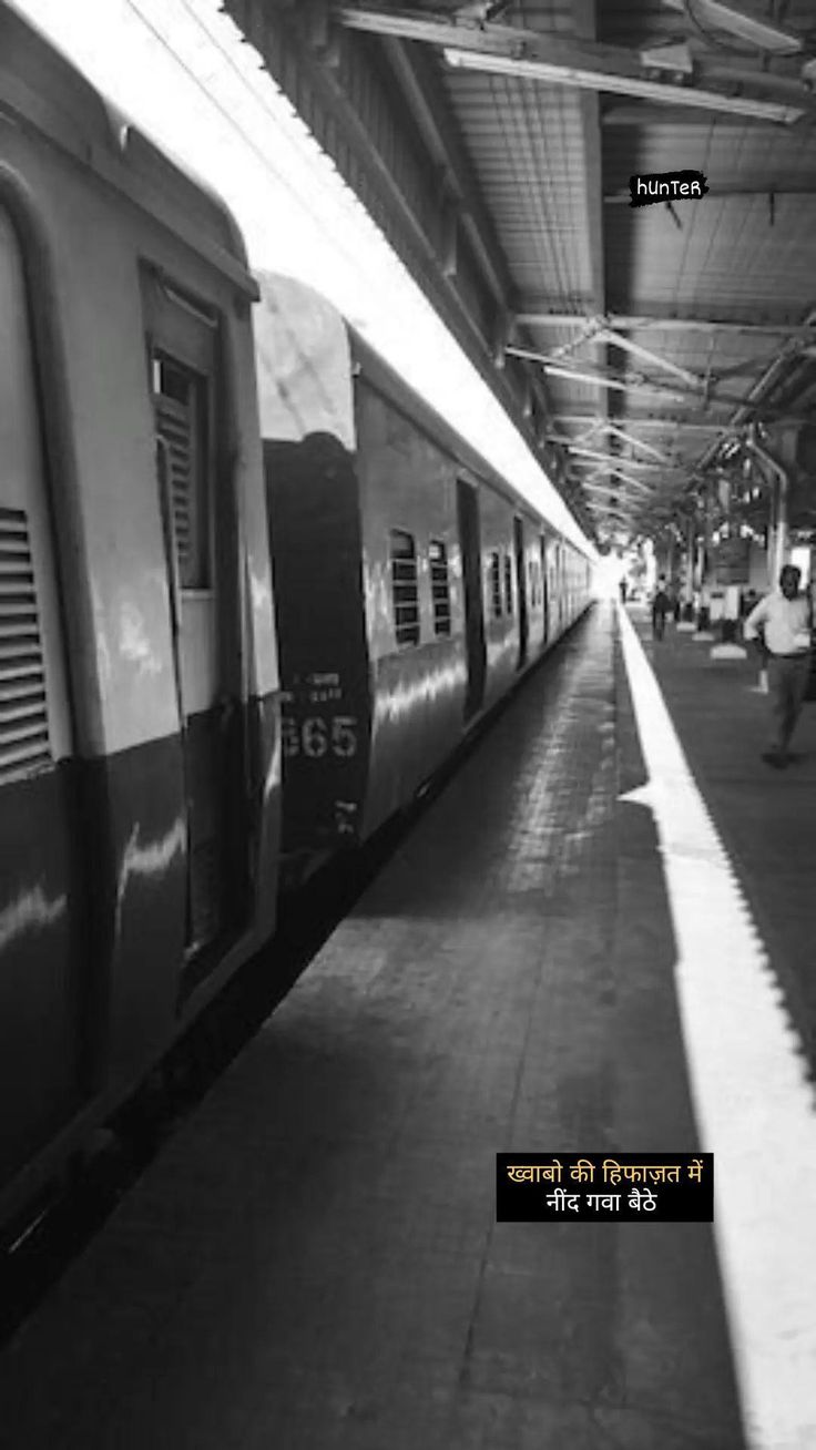 people are standing on the platform at a train station