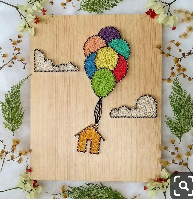 a wooden frame with an image of a hot air balloon in the shape of a horse