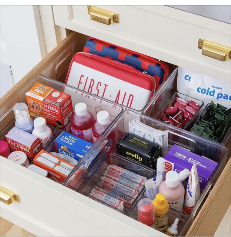 the drawers are filled with many different types of medicine and other medical care items in them