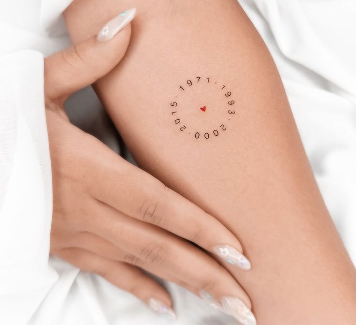 a woman's arm with the word love written on it