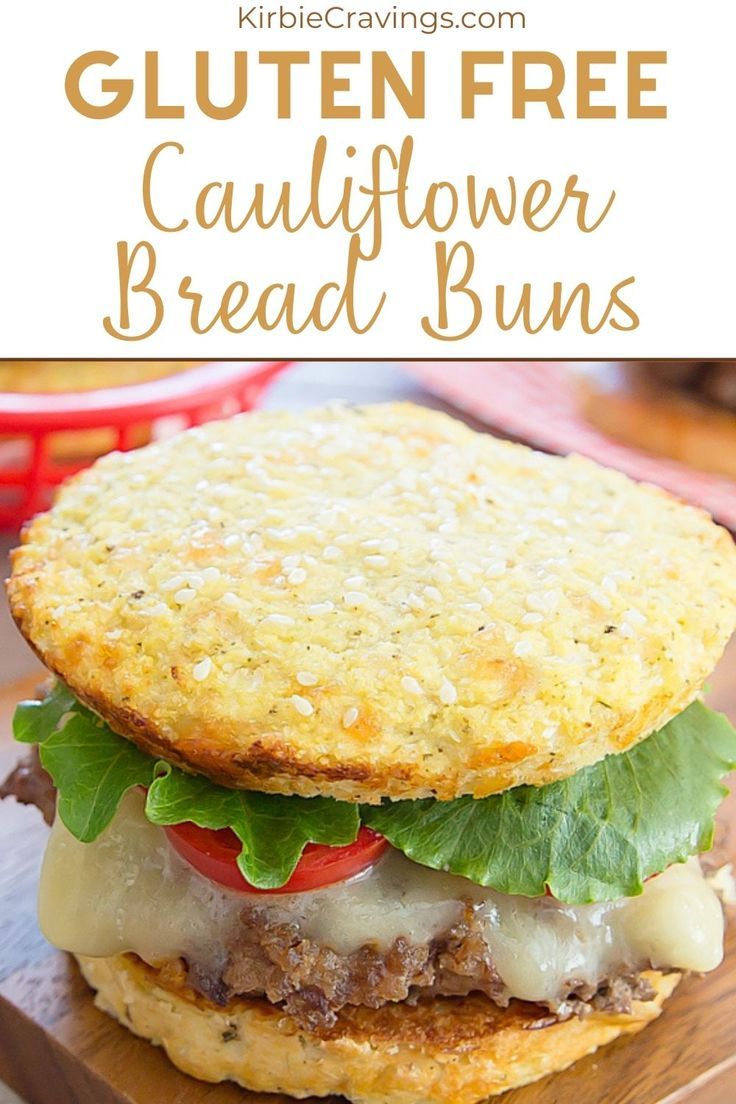 a close up of a sandwich on a cutting board with the words gluten free cauliflower bread buns