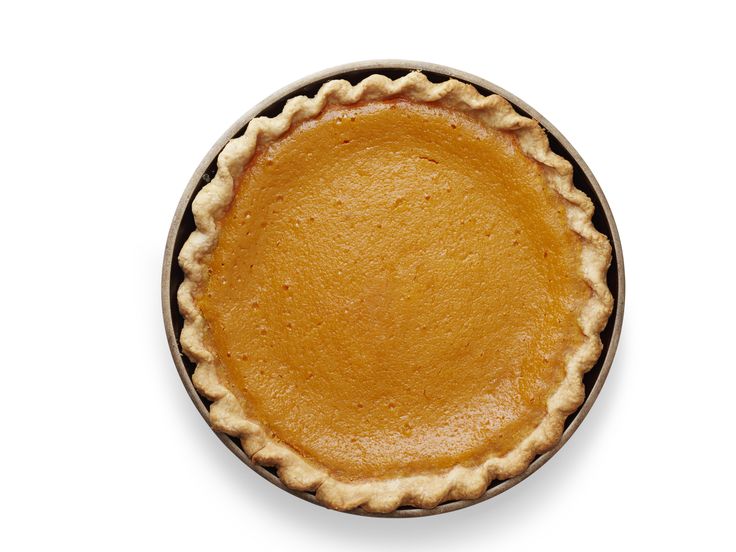 a pie crust in a bowl on a white background