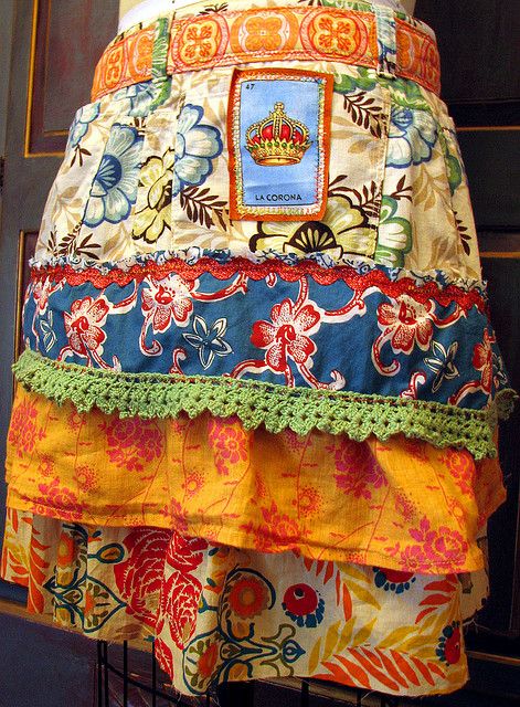 a colorful skirt is displayed on a rack