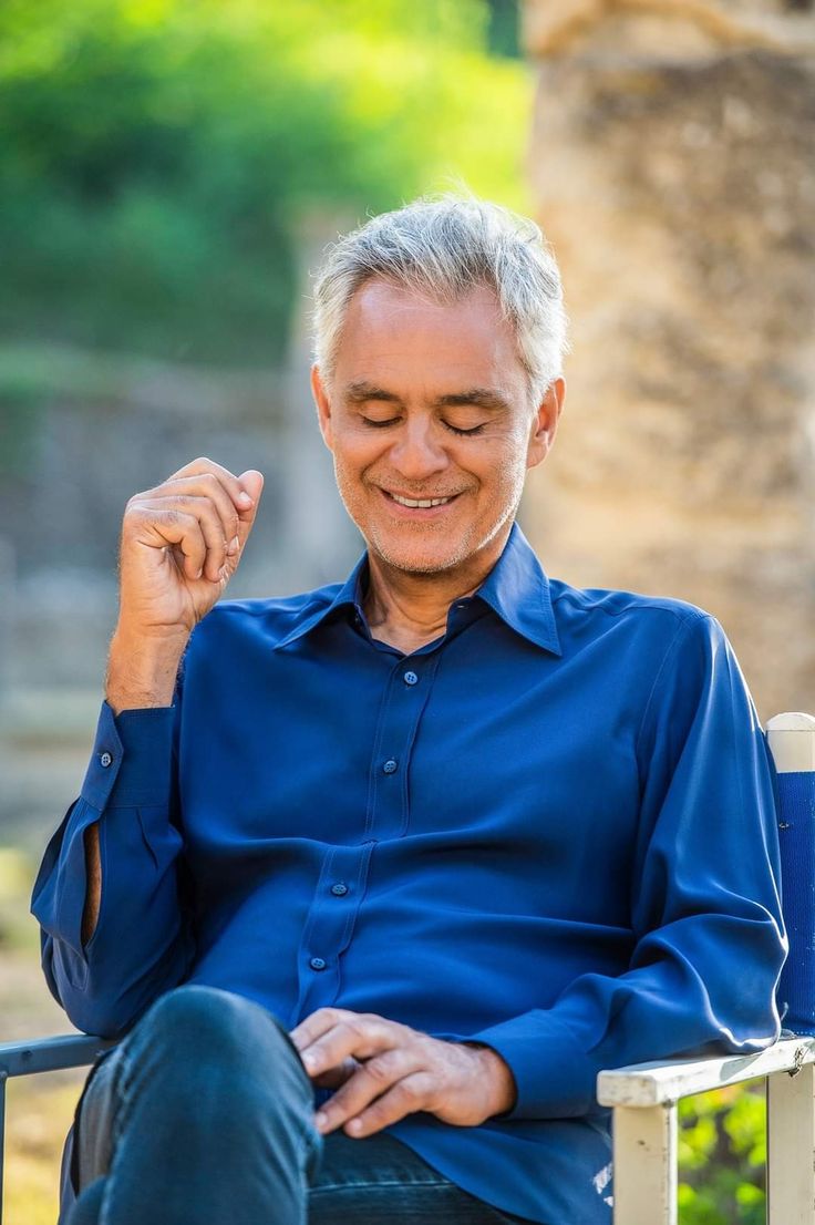 a man sitting in a chair with his eyes closed