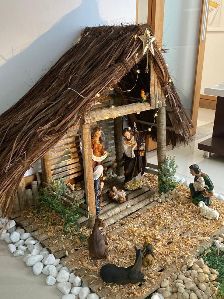 a nativity scene with figurines and decorations