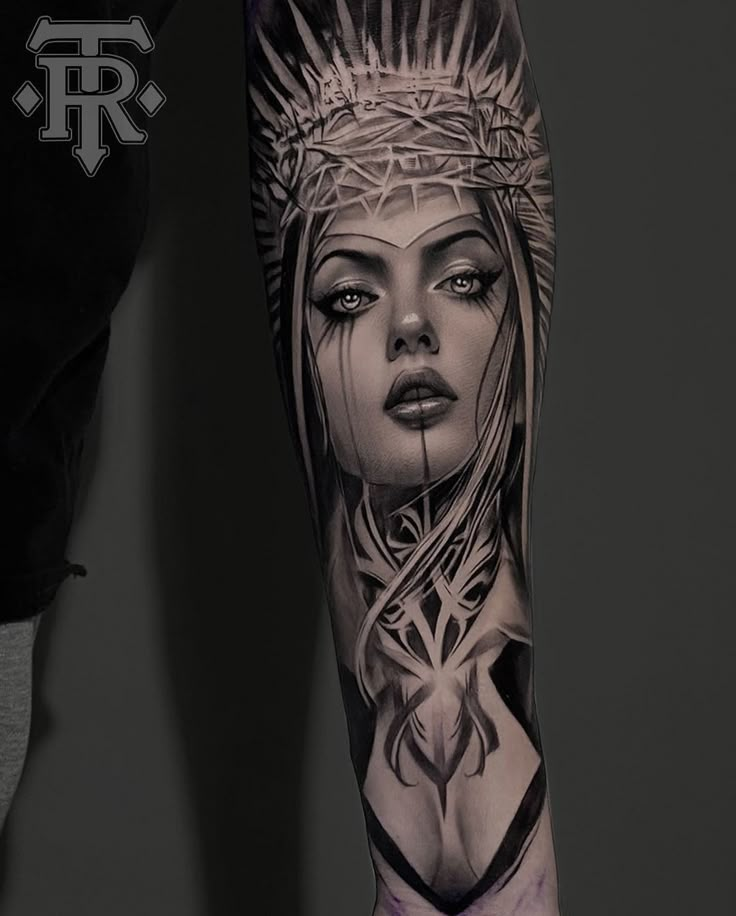 a woman's arm with tattoos on it and an image of the headdress