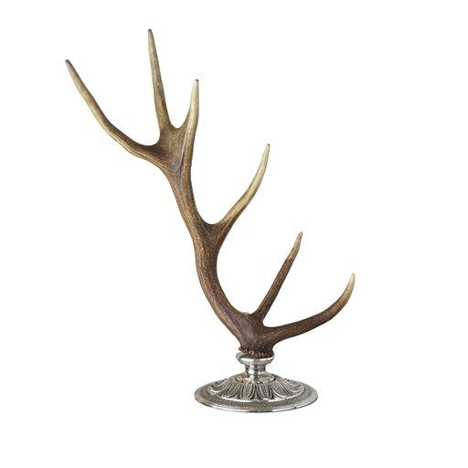 an antlers head on top of a metal stand