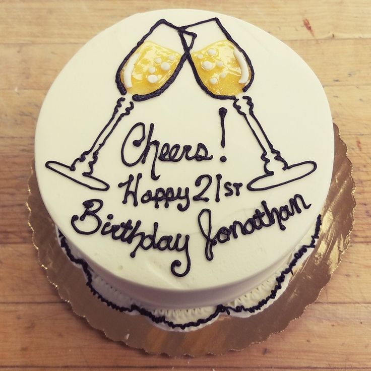 a birthday cake with two champagne glasses on it