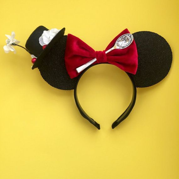 a mickey mouse ears with a top hat and bow tie