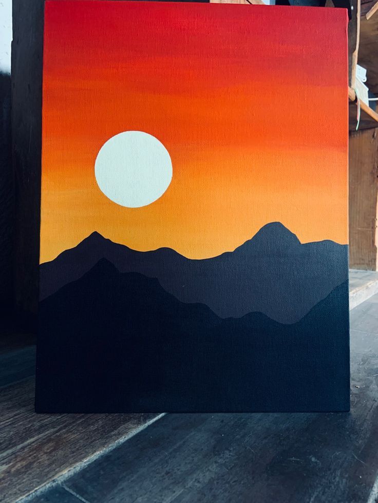 a painting of a sunset with mountains in the foreground and a person standing next to it