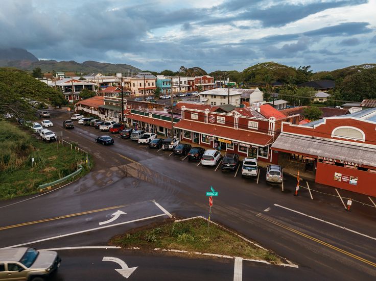 an overhead view of a town with cars parked on the street